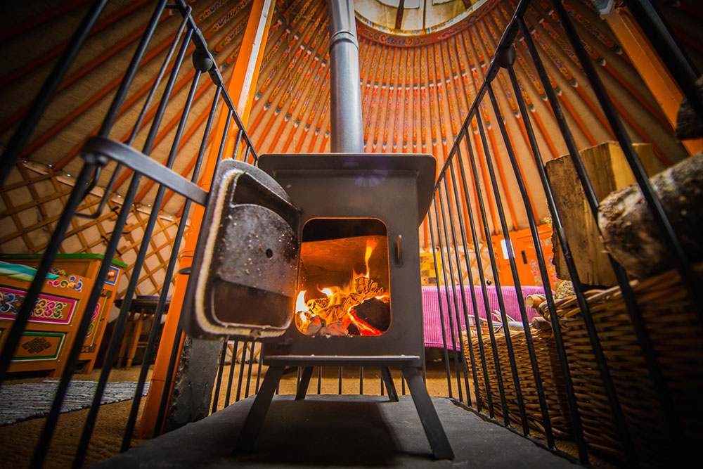 Log-fire-at-Hidden-Valley-Yurts-glamping-holiday-site